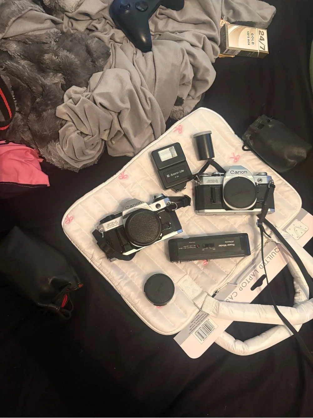 Two AE-1 Canon Film Camera’s in Black & Silver with two tripods